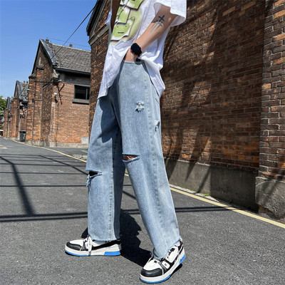 Férfi magas derekú farmer, szakadt motívumokkal