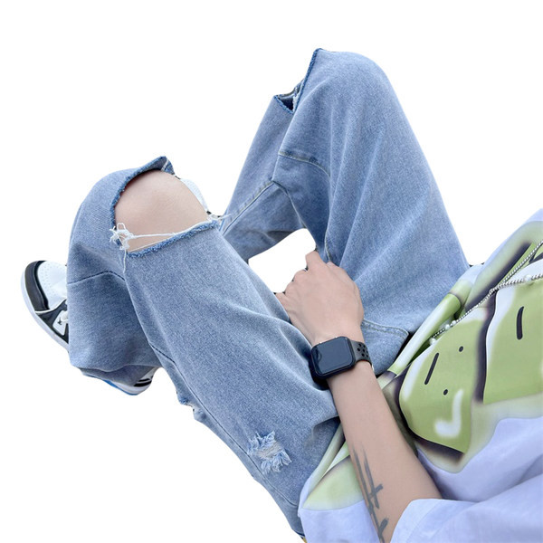 Férfi magas derekú farmer, szakadt motívumokkal