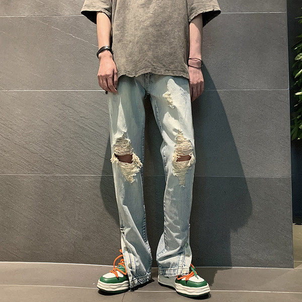 Meeste teksad rebitud motiivide ja nööpidega säärtel