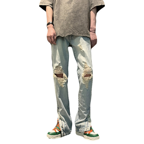 Meeste teksad rebitud motiivide ja nööpidega säärtel