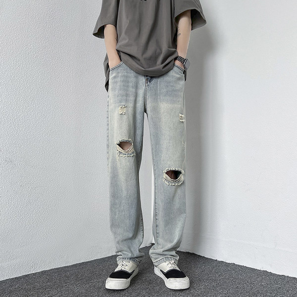 Férfi magas derekú farmer, szakadt motívumokkal