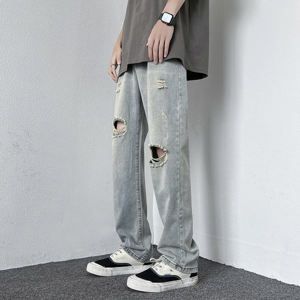 Férfi magas derekú farmer, szakadt motívumokkal