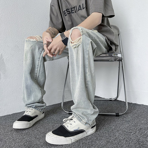 Férfi magas derekú farmer, szakadt motívumokkal