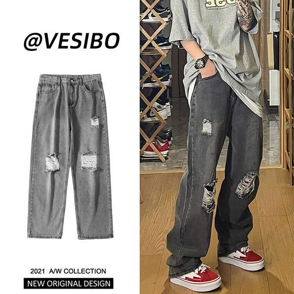 Bő, retró stílusú férfi farmer, szakadt motívummal