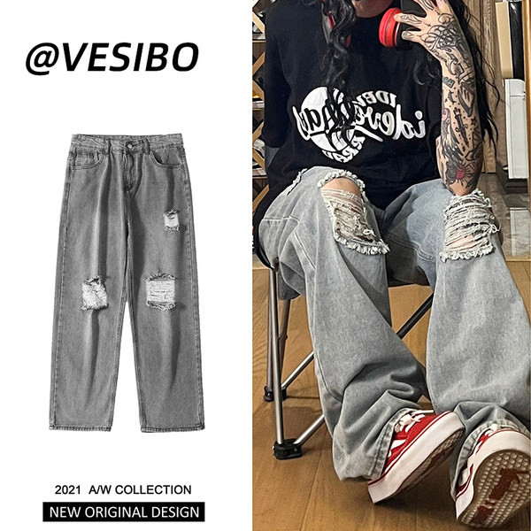 Bő, retró stílusú férfi farmer, szakadt motívummal