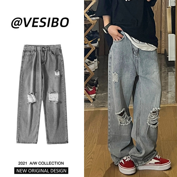 Bő, retró stílusú férfi farmer, szakadt motívummal