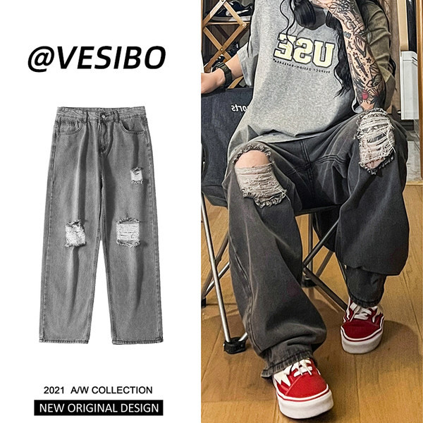 Bő, retró stílusú férfi farmer, szakadt motívummal