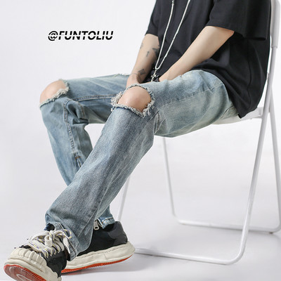 Szakadt motívumú férfi farmer