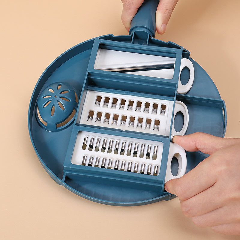 Daudzfunkcionāls dārzeņu griezējs virtuves rīki Kartupeļu smalcinātājs Šķēlīšu rīve Dārzeņu smalcinātājs Lāpstiņa Drenāžas grozs Virtuves sīkrīks