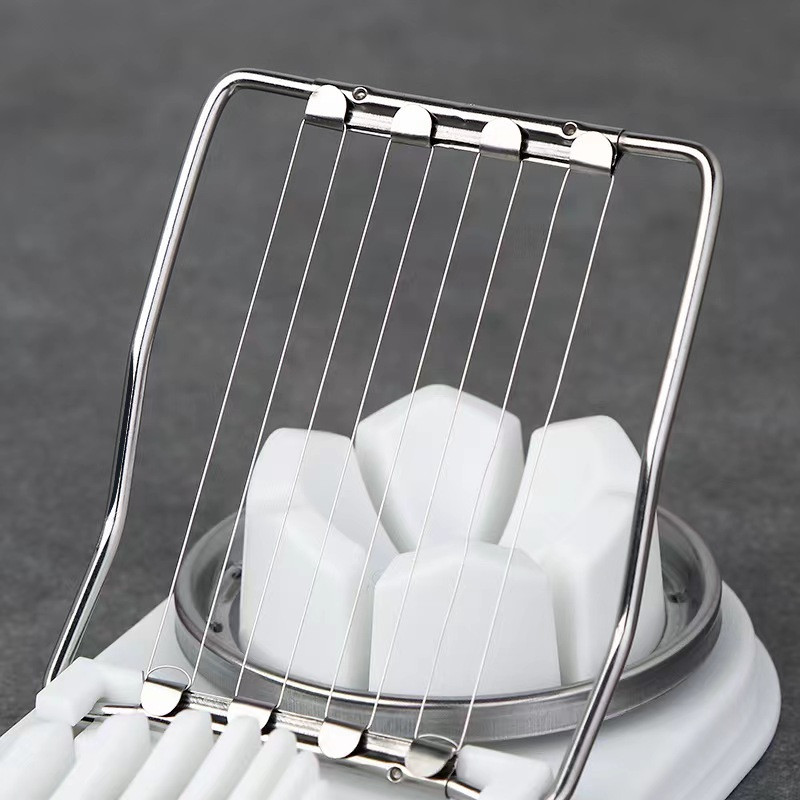 Daudzfunkcionāls nerūsējošā tērauda olu griezējs, manuāls griešanas un griešanas dalītājs radošais virtuves sīkrīks