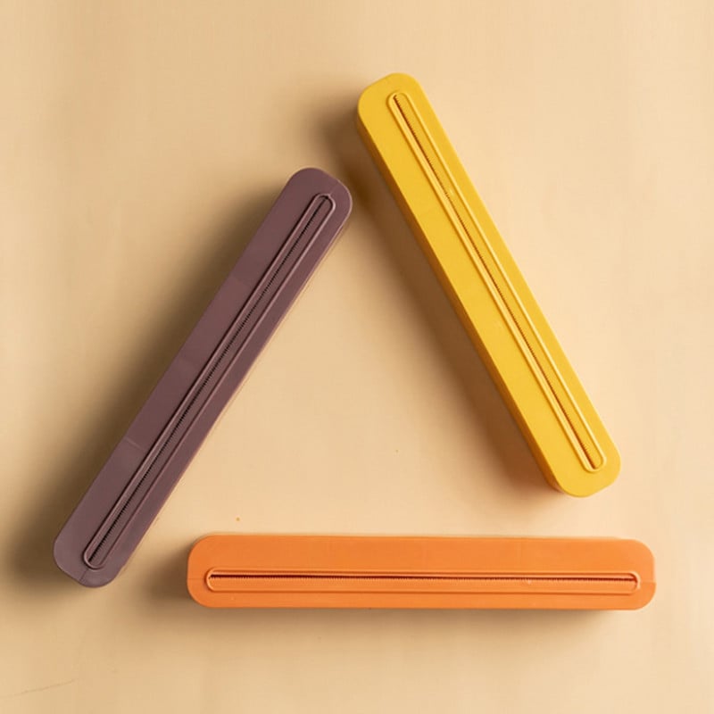 Toiduümbrise jaoturi lõikuri köögitööriist fooliumiga toidukilega ümbrise jaotur plastist terava lõikuri hoidiku hoidja köögitööriist