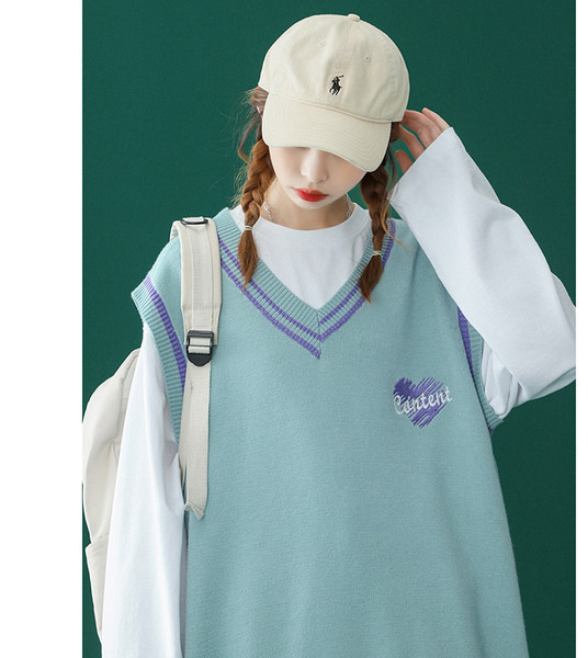 Moteriška V formos kaklo liemenė su siuvinėjimu