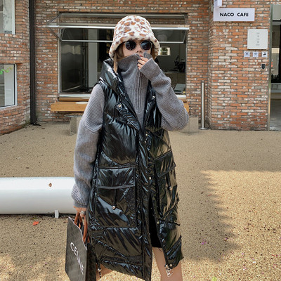 Jesensko-zimski široki prsluk s kapuljačom srednje dužine