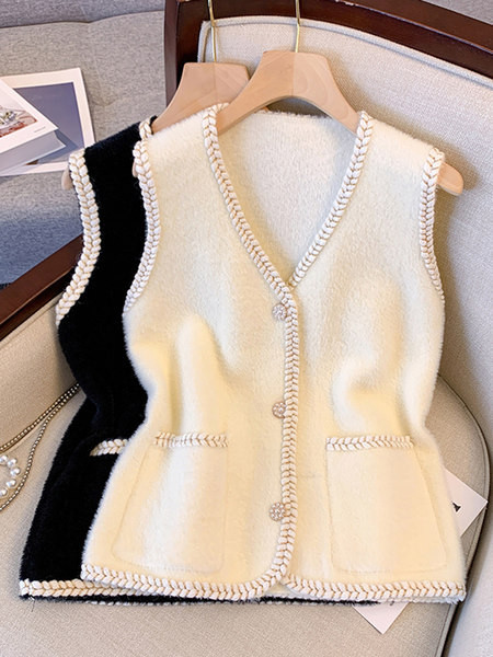 Moteriška megzta liemenė su sagomis