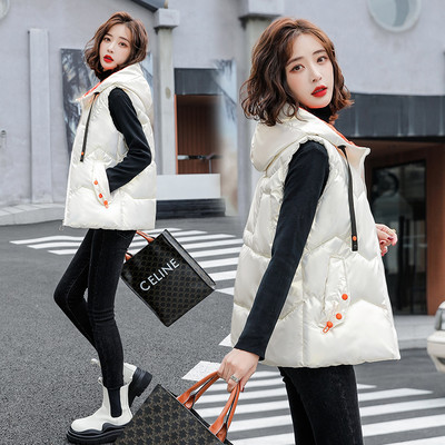 Ženski prsluk s kapuljačom i vezama