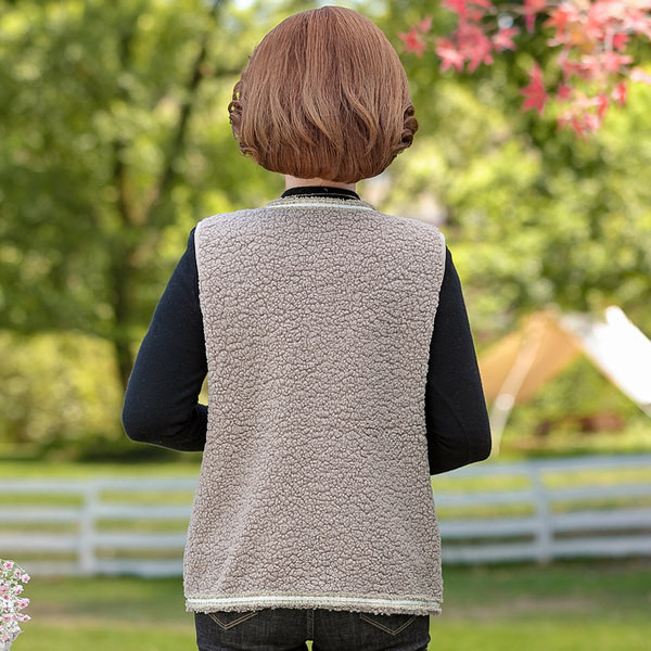 Női alkalmi mellény gombos rögzítéssel és zsebbel