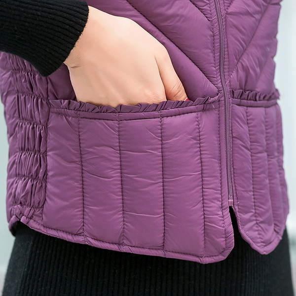 Moteriška žieminė liemenė su užtrauktuku ir kišene