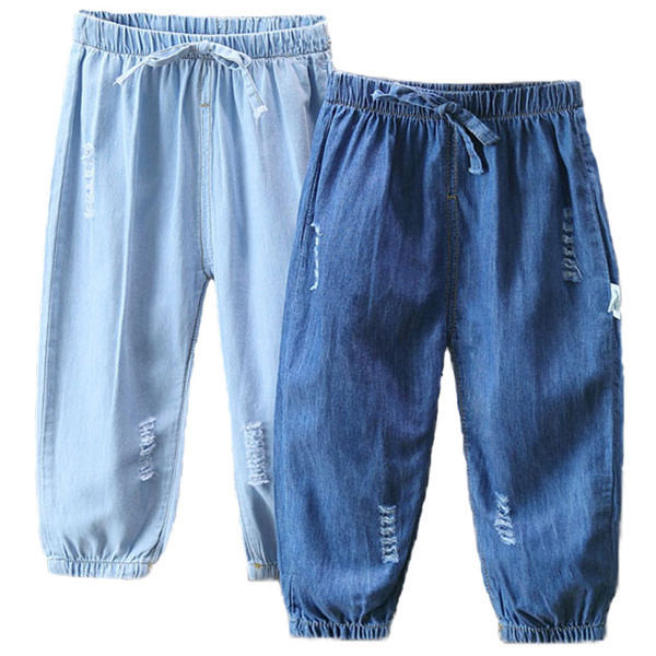 Dječje traperice sa vezicama i poderanim motivima