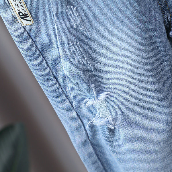 Dječje traperice s vezom i gumbom