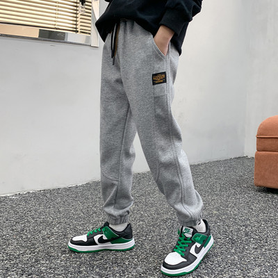 Sportinės kelnės berniukams su kišene ir kaklaraiščiais