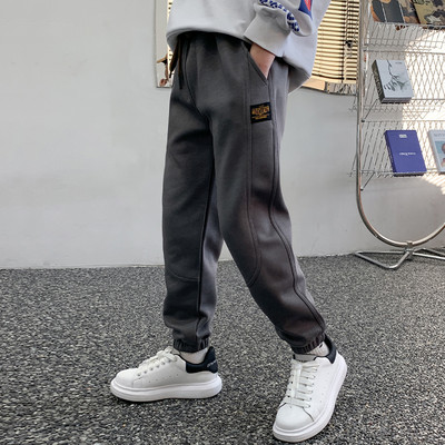 Sportinės kelnės berniukams su kišene ir kaklaraiščiais