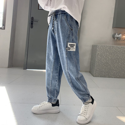 Fiúk széles szárú farmernadrágja fűzővel és zsebbel