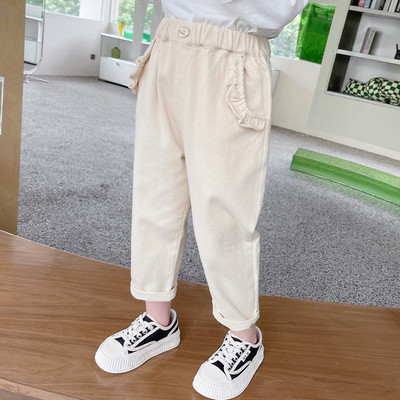 Gyermek nadrág gombbal és zsebbel