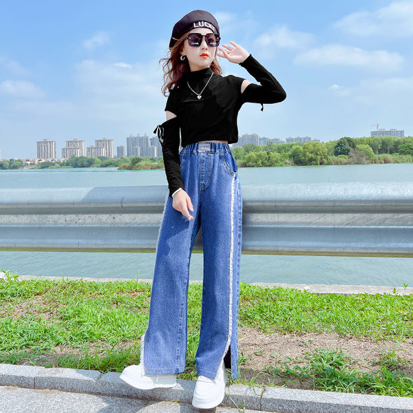 Mėlynos spalvos vaikiški laisvalaikio džinsai su skeltukais