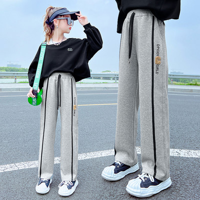 Vaikiškos sportinės kelnės mergaitėms su apvadu ir užrašu