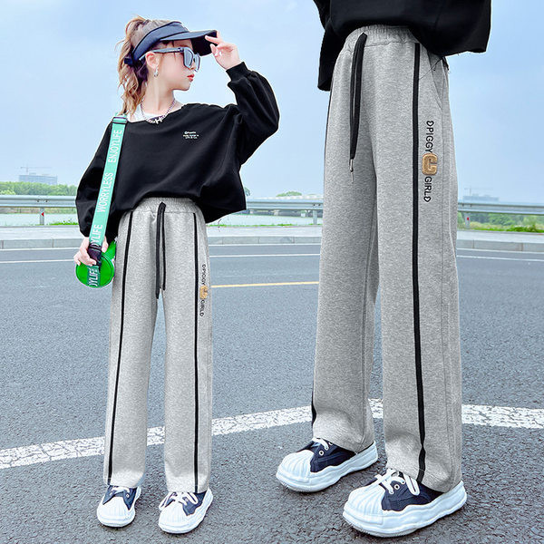 Vaikiškos sportinės kelnės mergaitėms su apvadu ir užrašu