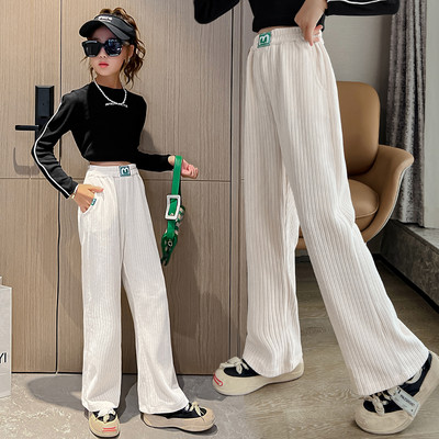 Dviejų spalvų vaikiškos kelnės su kišene