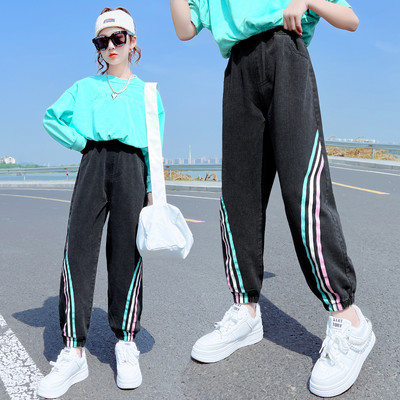 Új modell farmernadrág lányoknak színes szalaggal és gumival a szárán