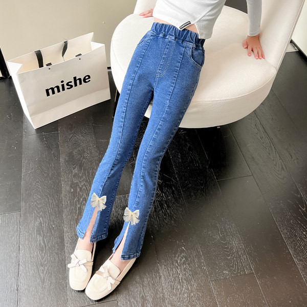 Blugi cu panglica si crapatura pe picior pentru fete