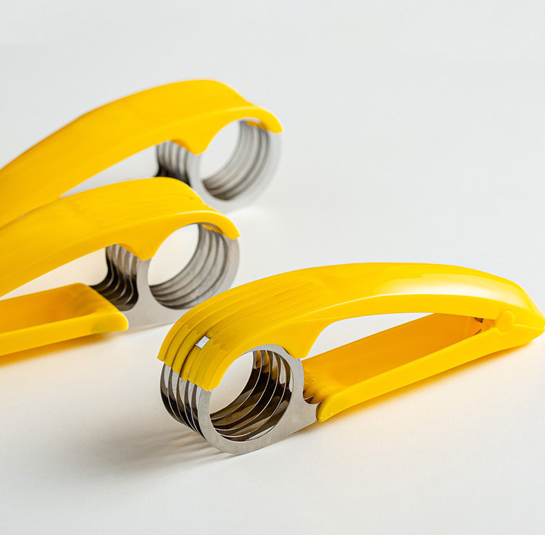 Vaisių pjaustyklė Bananų pjaustyklė Pjaustytos dešros pjaustyklės Kelios pjaustyklės salotos Kumpis Česnako griežinėliai Virtuvės prietaisai ir priedai Daržovių vaisių įrankis