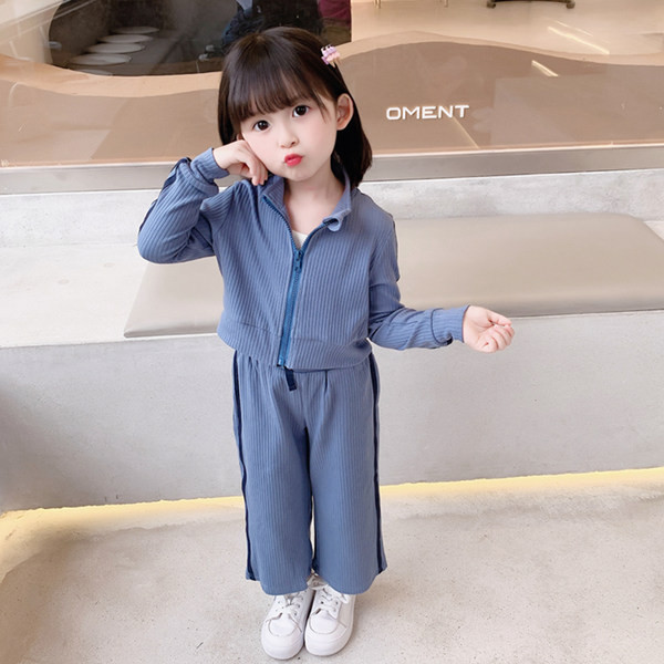 Set din două piese model nou, cu fermoar în partea de sus și în partea inferioară cu șireturi