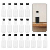 Butelių sultys su buteliuku tuščiu daugkartiniu mažu kakliuku ilga mini plastikine vandens talpykla dangteliams mėginio dangtelis stiklo kokteilis