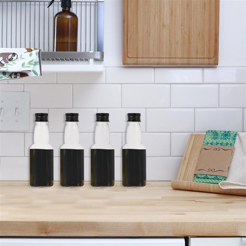 Butelių sultys su buteliuku tuščiu daugkartiniu mažu kakliuku ilga mini plastikine vandens talpykla dangteliams mėginio dangtelis stiklo kokteilis