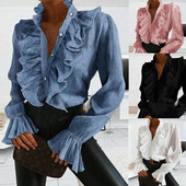 Elegantna ženska jesenska bluza dugih lepršavih rukava i dugmadi s volanima, gornji dio uredske košulje