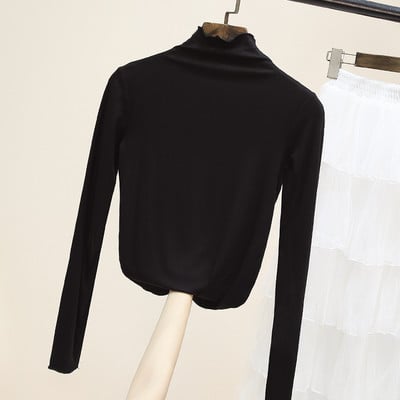 Női egyszínű blúz magas pólógallérral