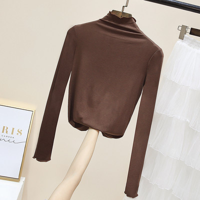 Női egyszínű blúz magas pólógallérral