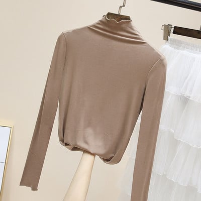 Női egyszínű blúz magas pólógallérral