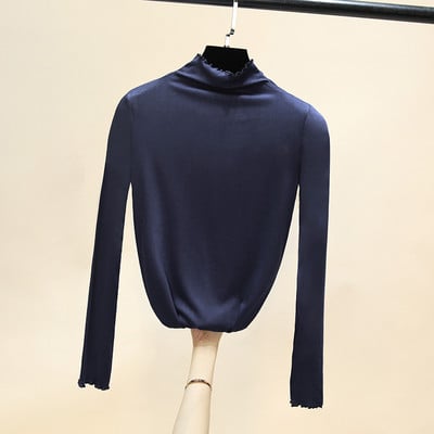 Női egyszínű blúz magas pólógallérral