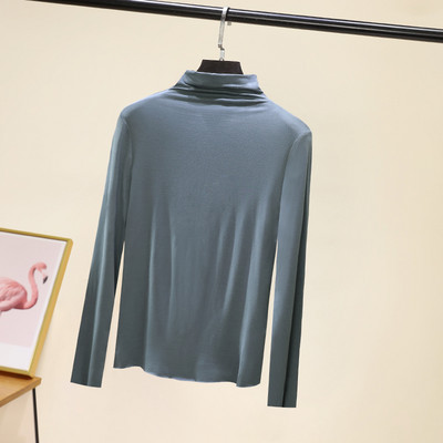 Švarus moteriškos palaidinės su aukšta apykakle modelis