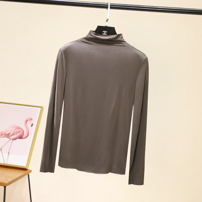 Švarus moteriškos palaidinės su aukšta apykakle modelis