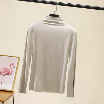 Švarus moteriškos palaidinės su aukšta apykakle modelis