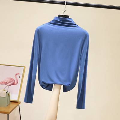 Švarus moteriškos palaidinės su aukšta apykakle modelis