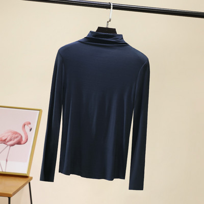 Švarus moteriškos palaidinės su aukšta apykakle modelis