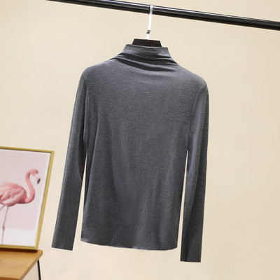 Švarus moteriškos palaidinės su aukšta apykakle modelis