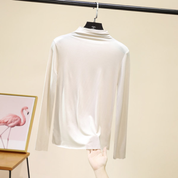 Švarus moteriškos palaidinės su aukšta apykakle modelis