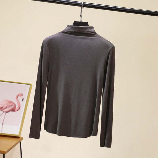 Švarus moteriškos palaidinės su aukšta apykakle modelis